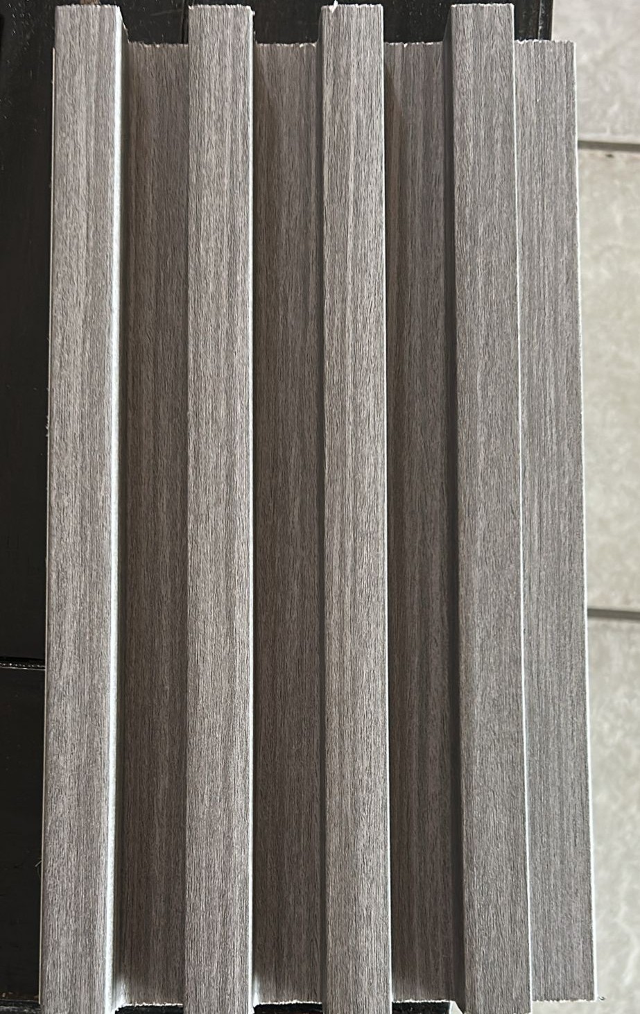 WhatsApp Image 2026-04-22 at 9.56.18 AM WPC (Wood Plastic Composite) slat wall panel are an innovative and eco-friendly wall cladding solution that is made from a blend of wood fiber and recycled plastic. These panels offer the natural beauty of wood with the durability of plastic