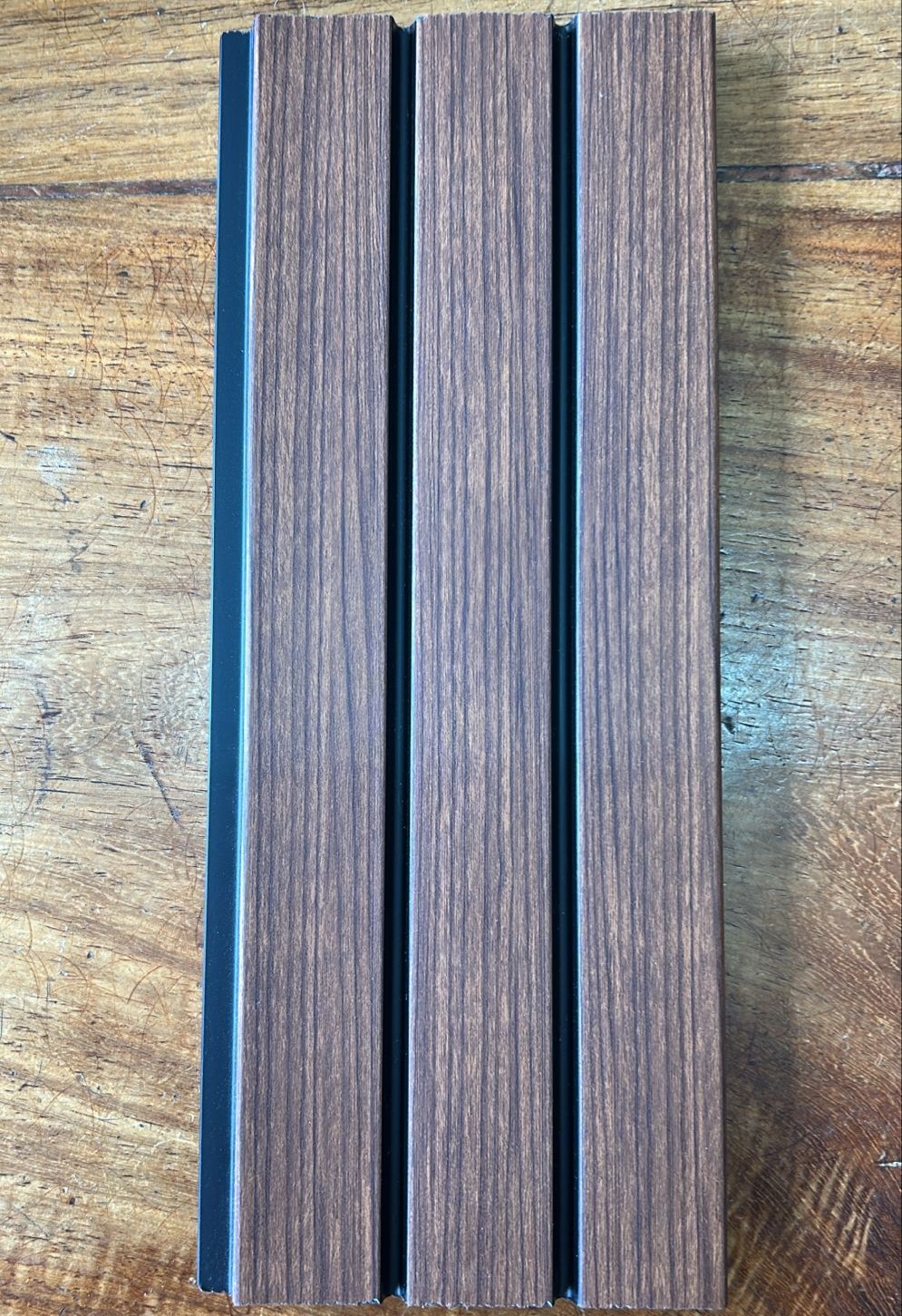 WhatsApp Image 2026-04-23 at 9.23.53 AM WPC (Wood Plastic Composite) slat wall panel are an innovative and eco-friendly wall cladding solution that is made from a blend of wood fiber and recycled plastic. These panels offer the natural beauty of wood with the durability of plastic